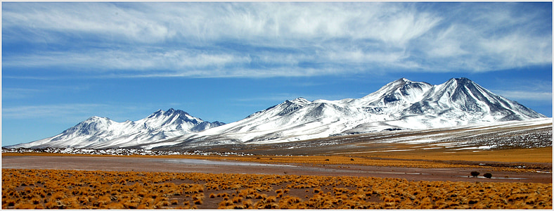 mountain at distance under clouds thumbnail