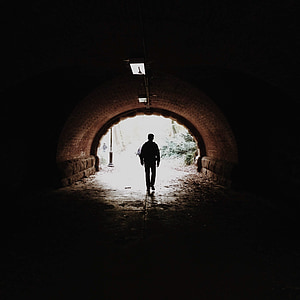 man walking in tunnel thumbnail