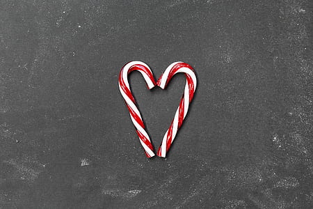two candy canes making heart shape thumbnail