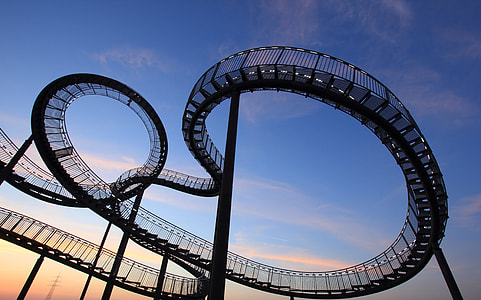 roller coaster under blue sky and white clouds thumbnail