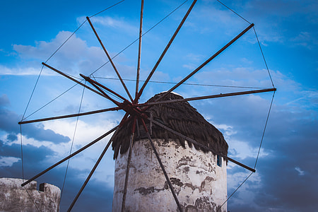 white and brown windmill under blue sky during daytime thumbnail