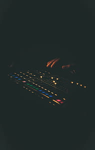 person going to touch black mixing console thumbnail