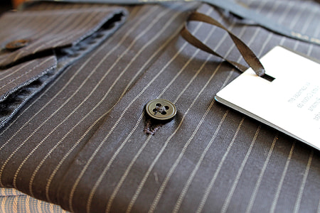 close-up photo of black and gray striped button-up shirt thumbnail