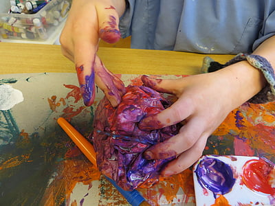 person putting colors on crumpled paper thumbnail