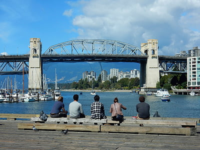 five people sitting on wood plank thumbnail