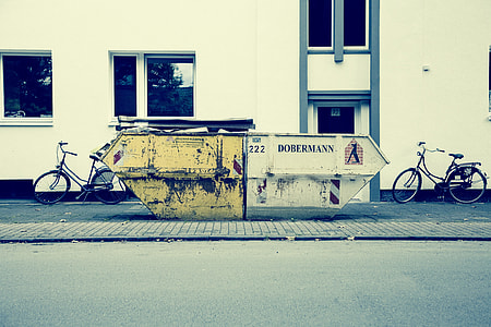 white and yellow industrial machine on gray pavement thumbnail