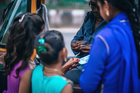 Girls Near Man Holding Money thumbnail