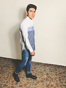 Man In White And Grey Dress Shirt And Blue Fitted Denim Jeans Outfit thumbnail