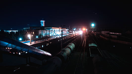 aerial photography of train rails at night time thumbnail