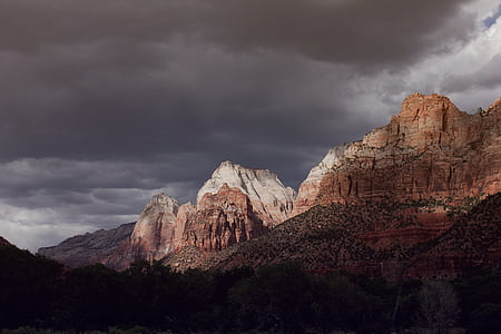 brown canyon under nimbus clouds thumbnail