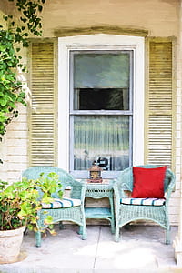 two green wicker armchairs near sash window thumbnail