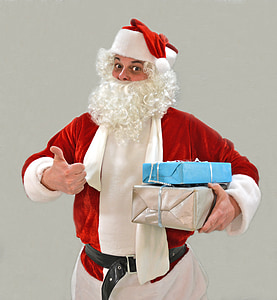 man in Santa Claus costume holding gift boxes thumbnail