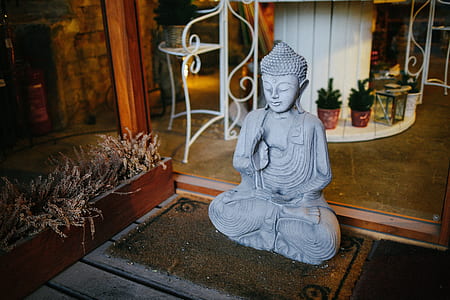 Gautama Buddha statuette on floor rug thumbnail
