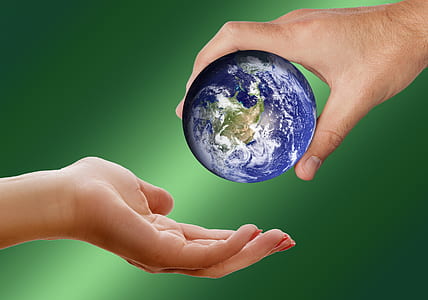 person holding earth ball thumbnail