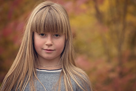 focus photography of girl wearing gray knitted top thumbnail