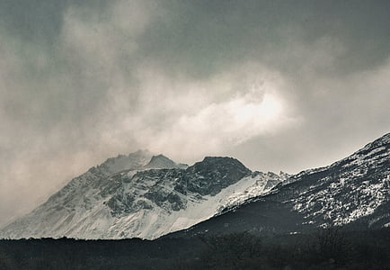 snow covered mountain with clouds thumbnail