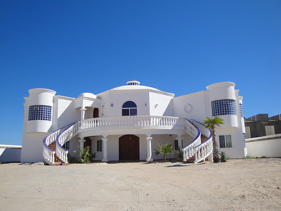 white building under blue calm sky thumbnail