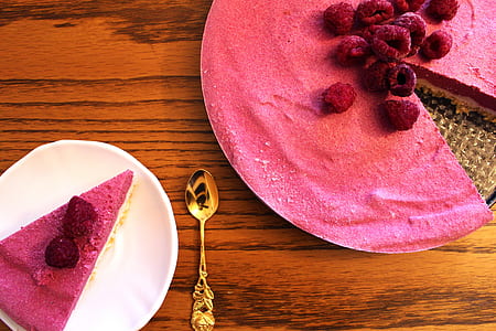 slice of pink cheese cake on white ceramic saucer thumbnail