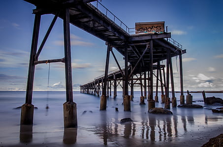 brown wooden bridge under water thumbnail
