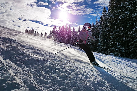 person in gray winter jacket and black pants doing ski during daytime thumbnail