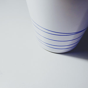 white cup on white surface thumbnail