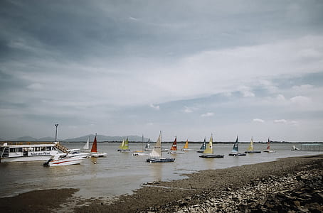 sailboats near seashore thumbnail