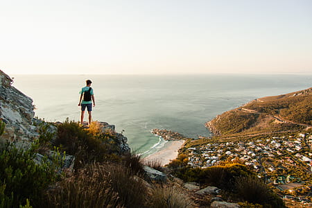 man standing on mountains thumbnail