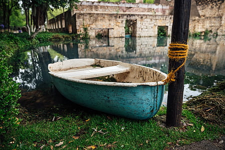 blue and white wooden rowboat thumbnail