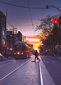 woman wearing black jacket crossing on pedestrian lane thumbnail