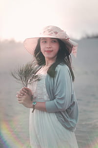 Woman Holding Brown Twig thumbnail