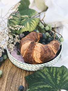 croissant bread and grapes on tray thumbnail