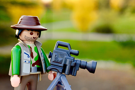 selective focus photography of toy camera man with camera thumbnail