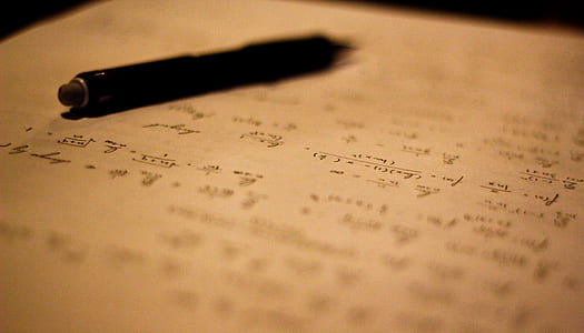black click pen on white and black paper thumbnail