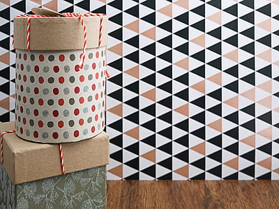 two round and rectangular boxes near wall thumbnail