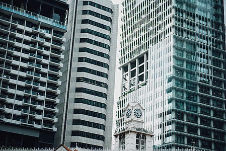person showing white concrete building thumbnail