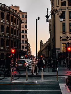 group of people walking on the street beside road thumbnail