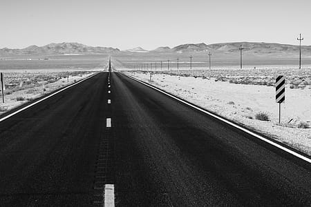 Grayscale Photo of Road on Desert thumbnail