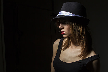 woman wearing  black fedora hat and tank top thumbnail