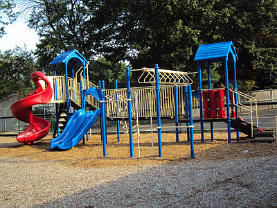 empty blue and red slide and swing thumbnail