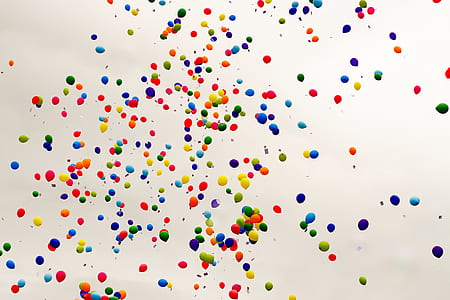 assorted-color balloons flying in the sky thumbnail