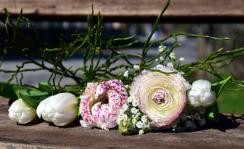 white and purple petaled flowers on brown wooden surface thumbnail