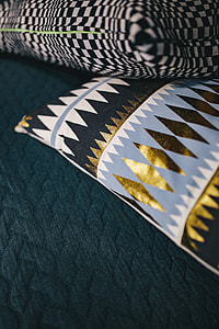 Close-ups of pillows and a grey sofa thumbnail