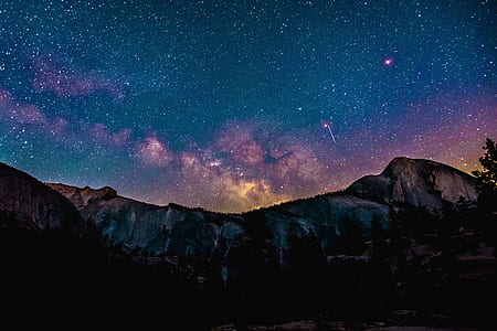 silhouette photography of mountain and stars thumbnail