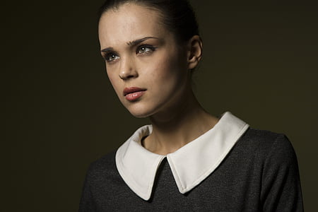 woman wearing white and black collared top thumbnail