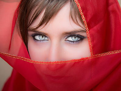 closeup photography of woman in red headdress thumbnail