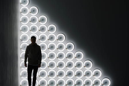 silhoutte of standing behind white LED lights thumbnail