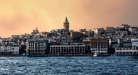 landscape photo of city town near body of water thumbnail