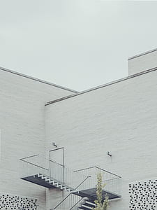 white concrete house under gray clouds thumbnail