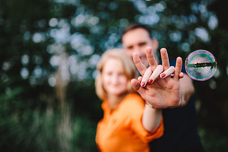 Young couple holding hands outdoors thumbnail