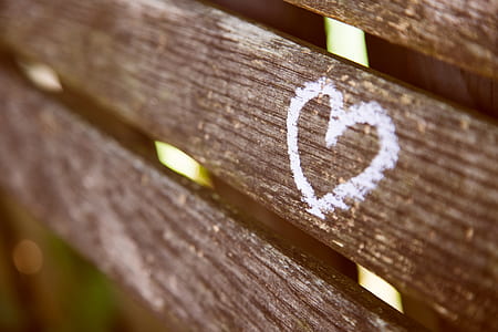 white heart illustration on brown wooden board thumbnail